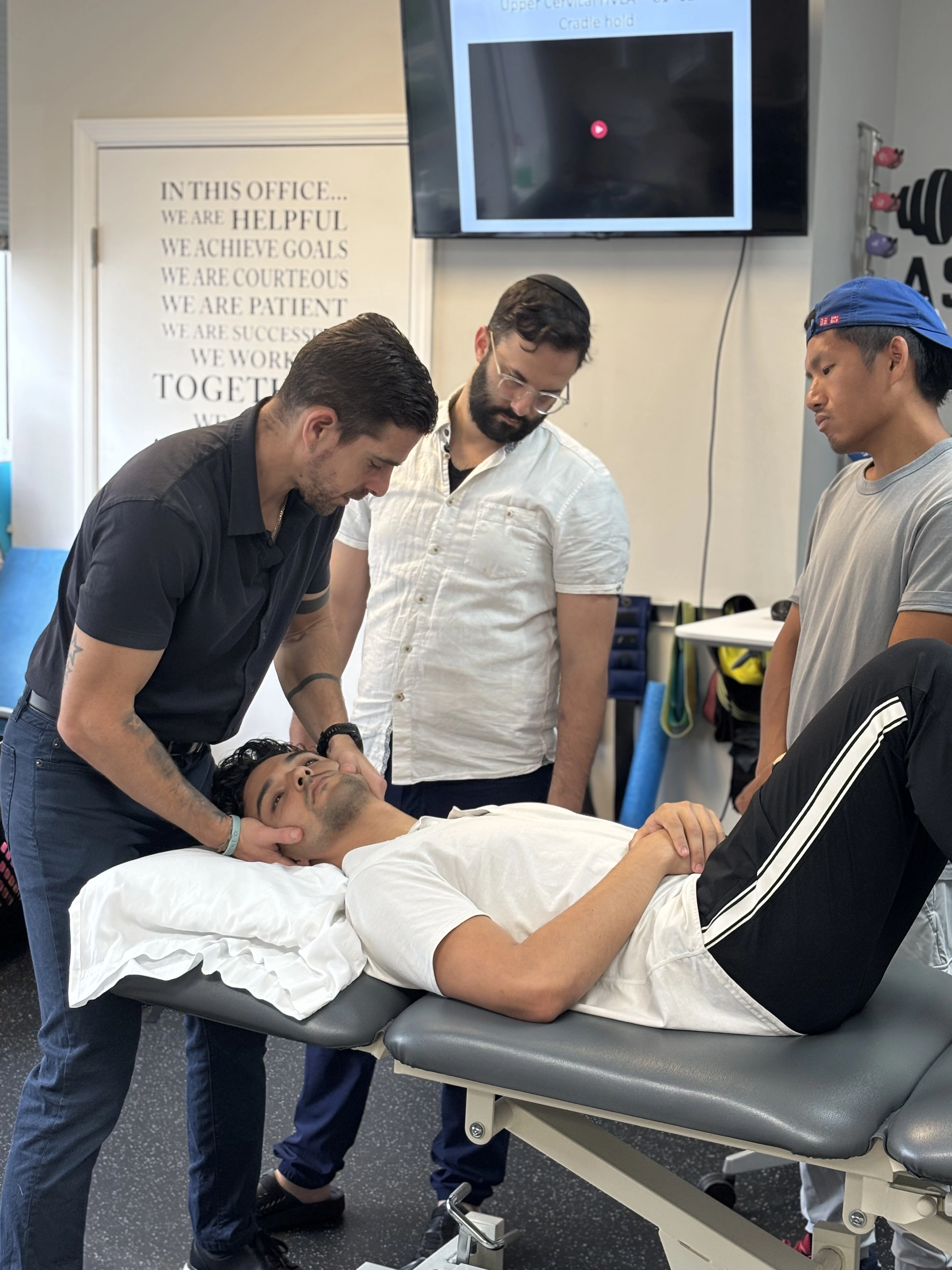 Dr. Fiksel working hands-on with a patient